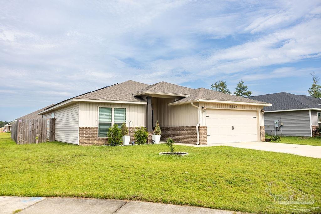 a front view of a house with yard