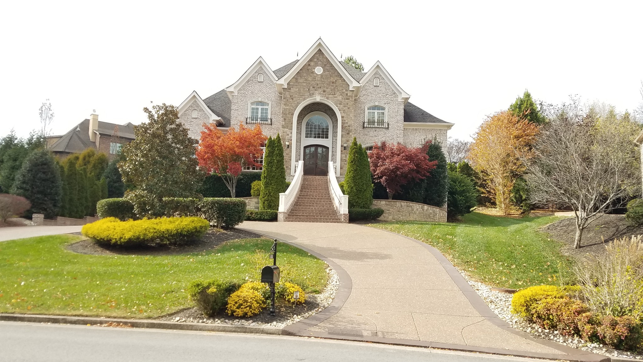 a front view of a house with garden