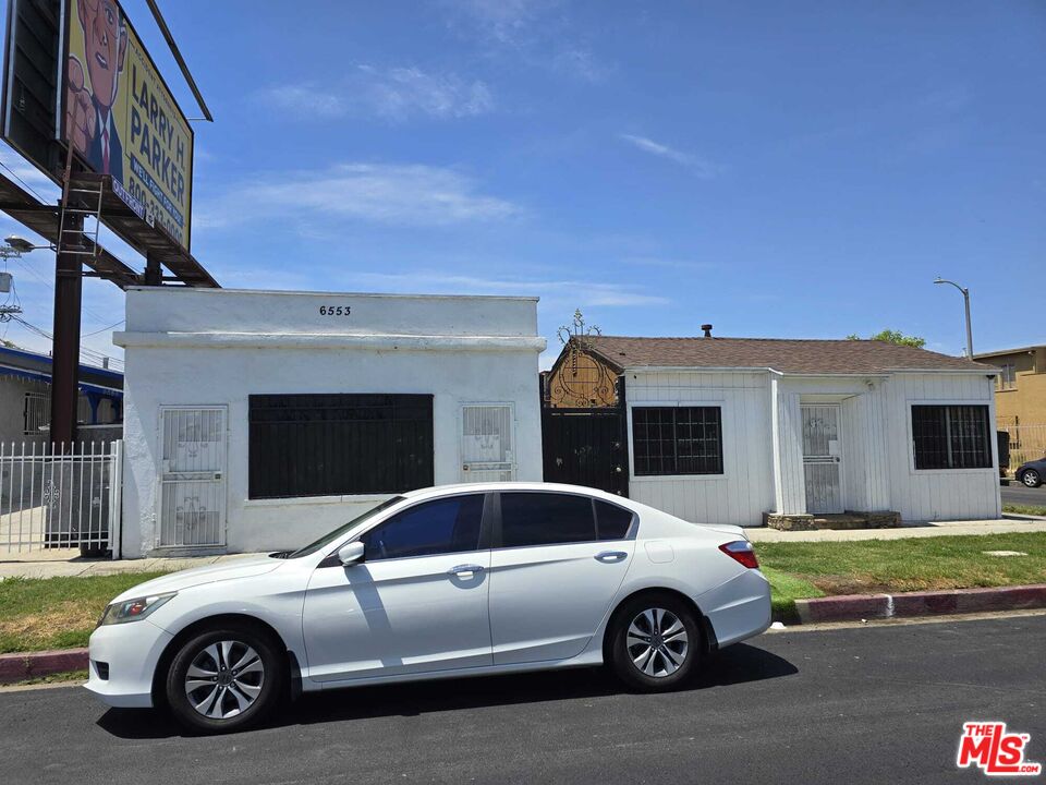 a car parked in front of a house