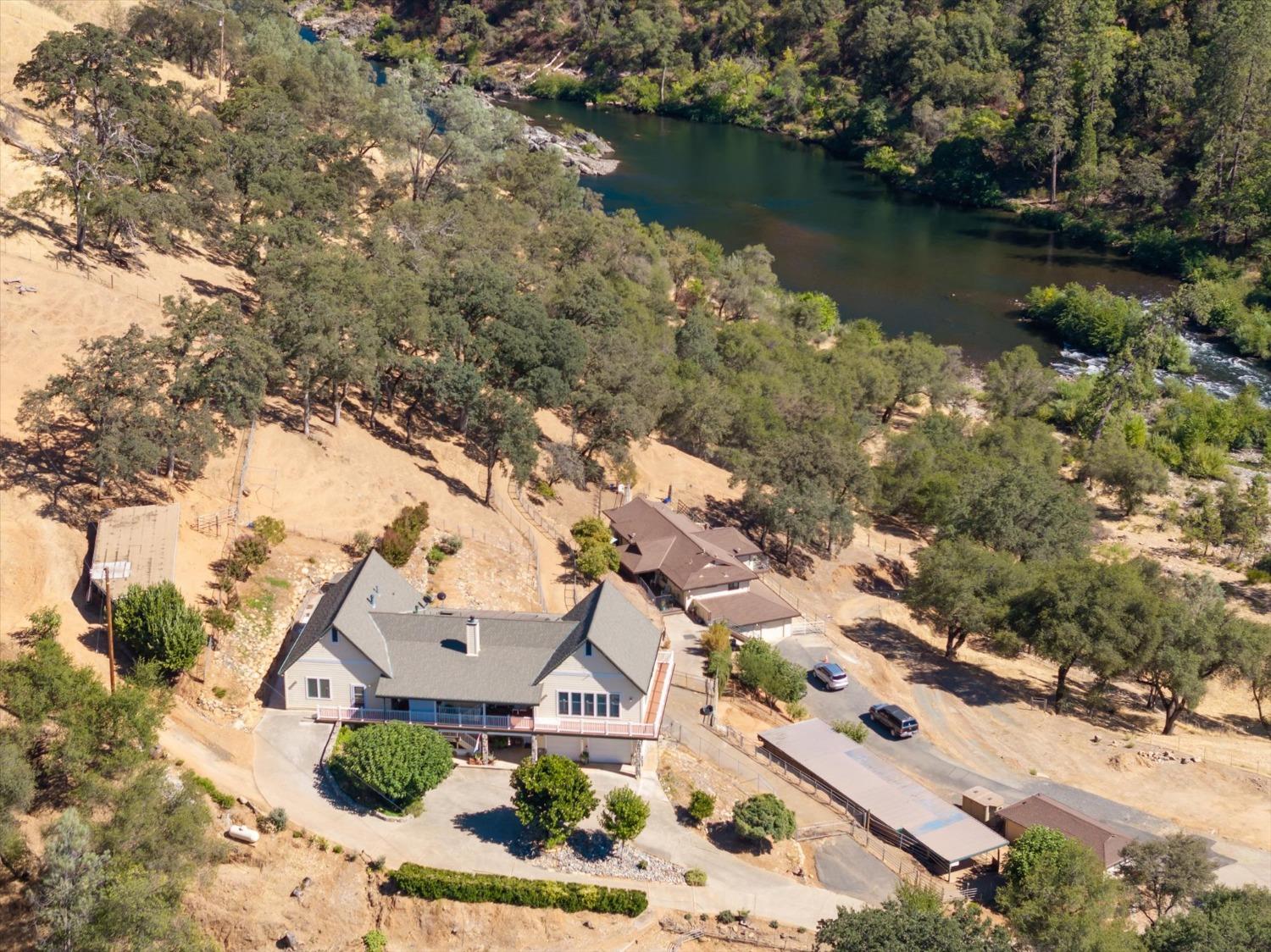 an aerial view of a house with a lake view