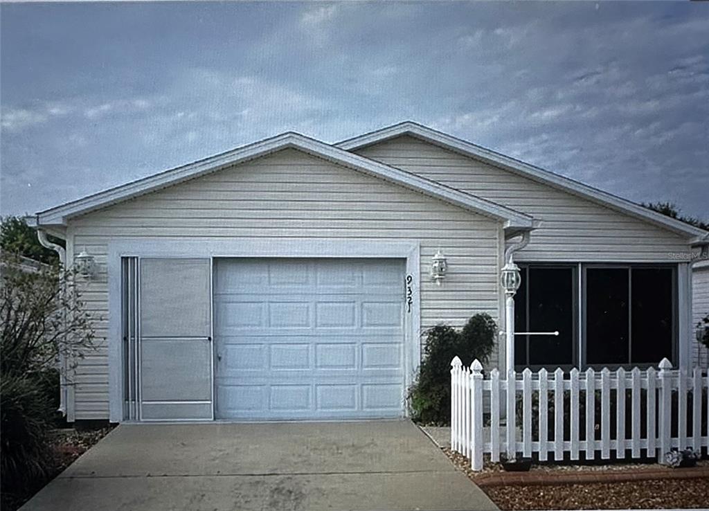 a front view of a house with a garage