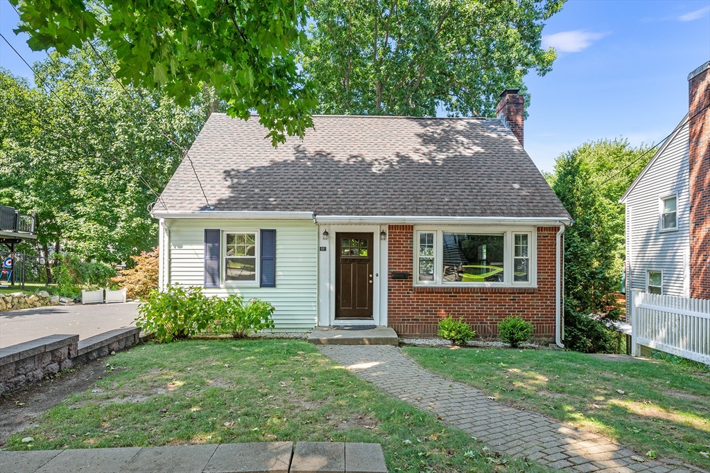 front view of a house with a yard