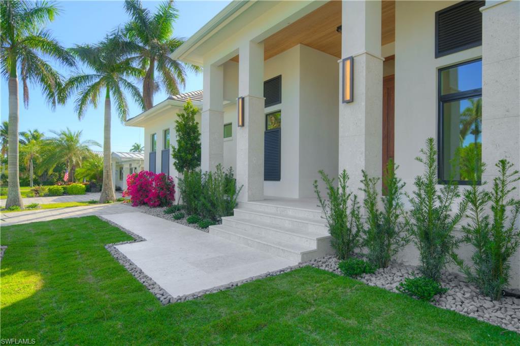 Property entrance with a lawn