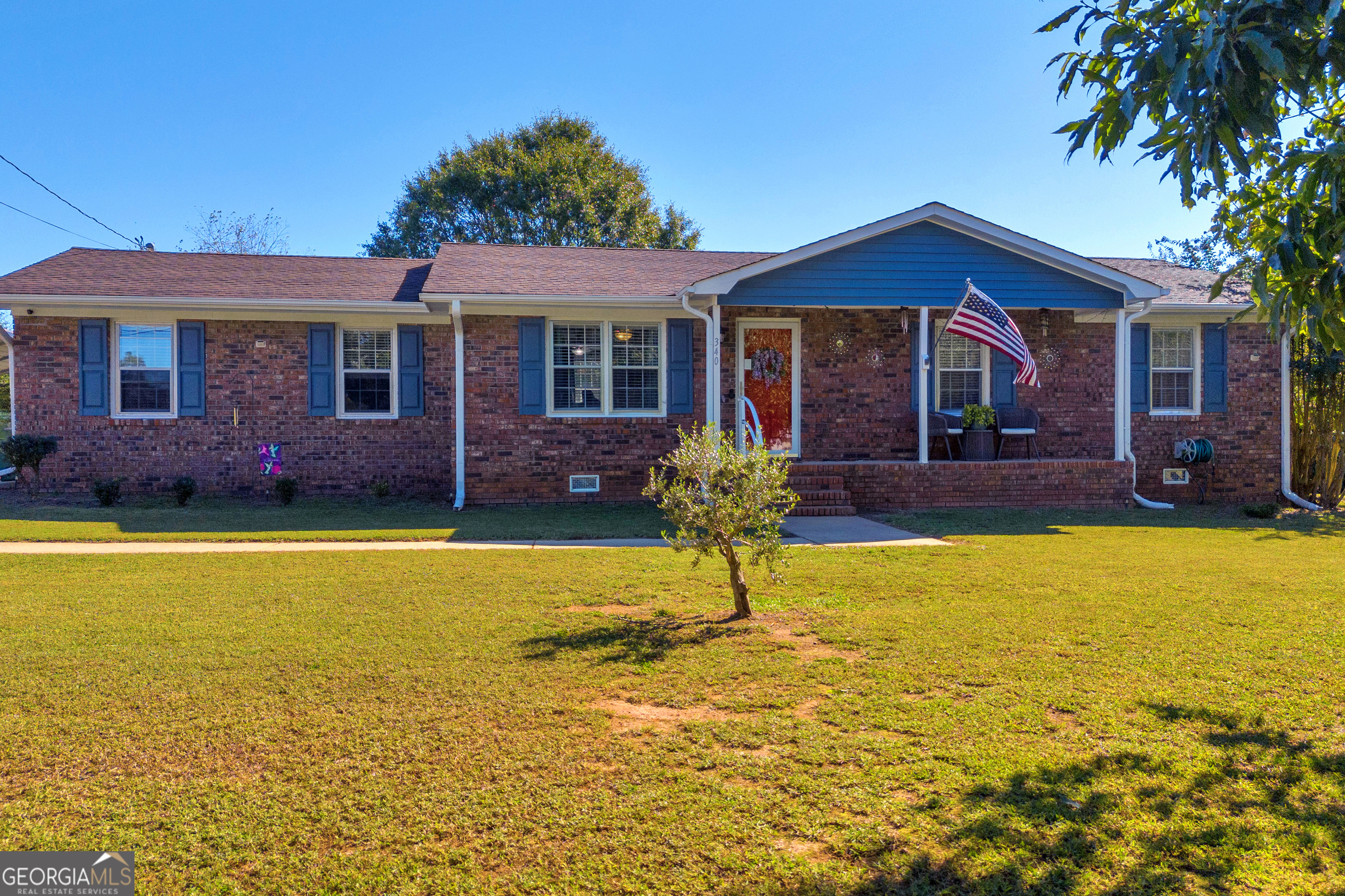 a front view of house with yard and patio