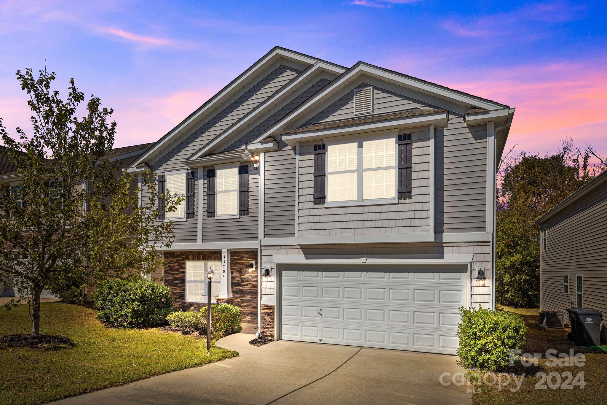 a front view of a house with a yard