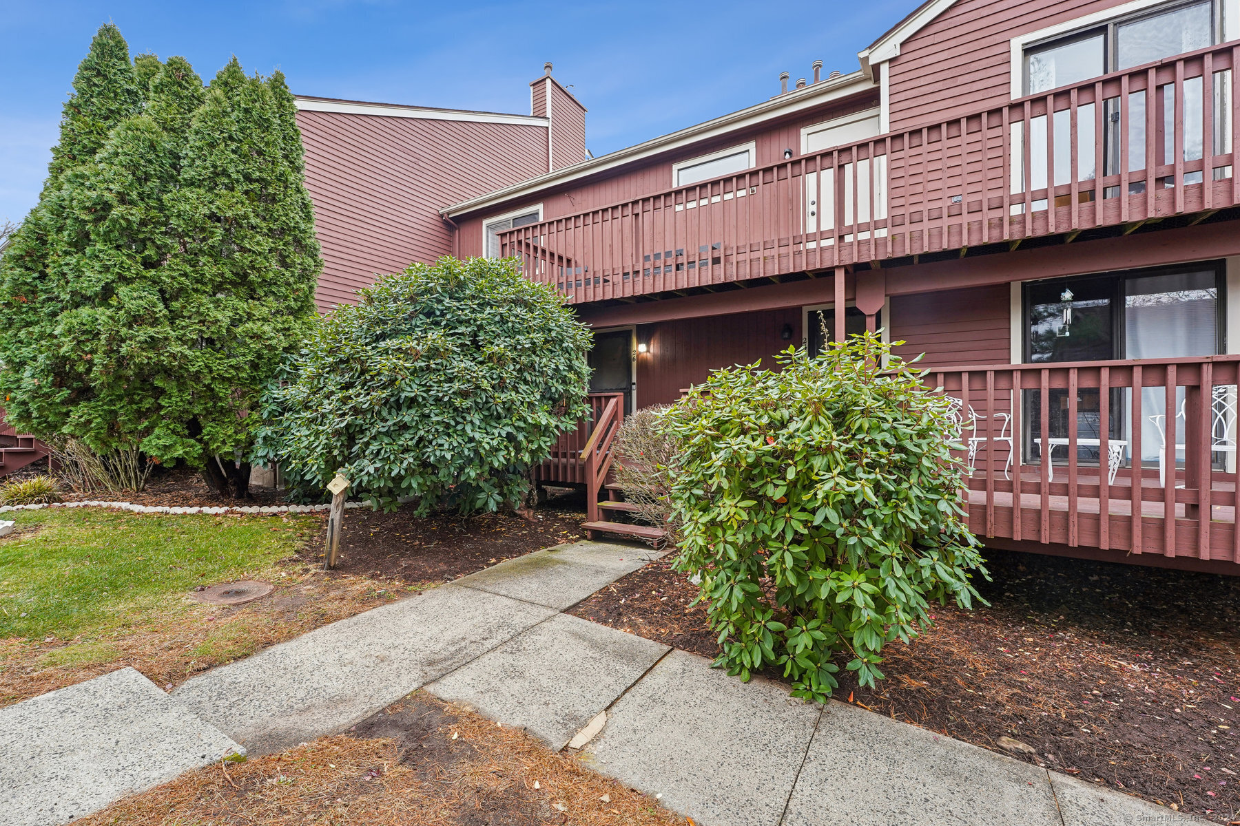 a front view of a house with garden