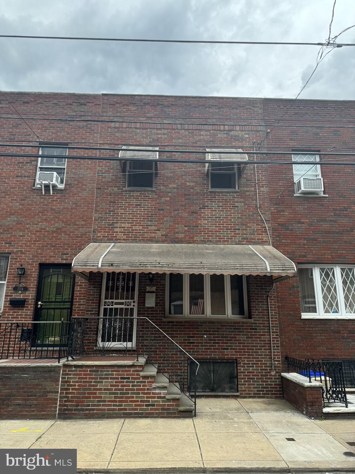 a front view of a house with glass windows