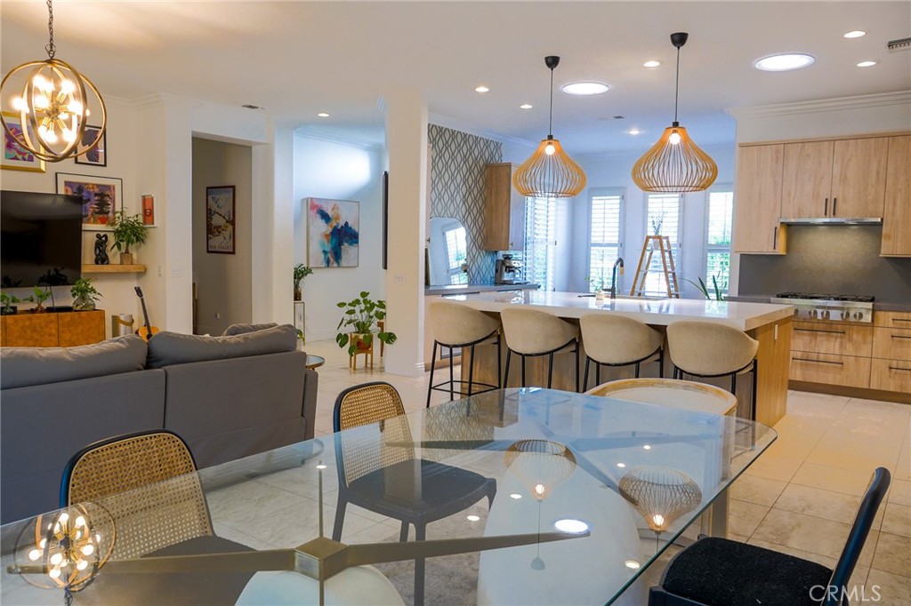 a open kitchen with dining table and chairs