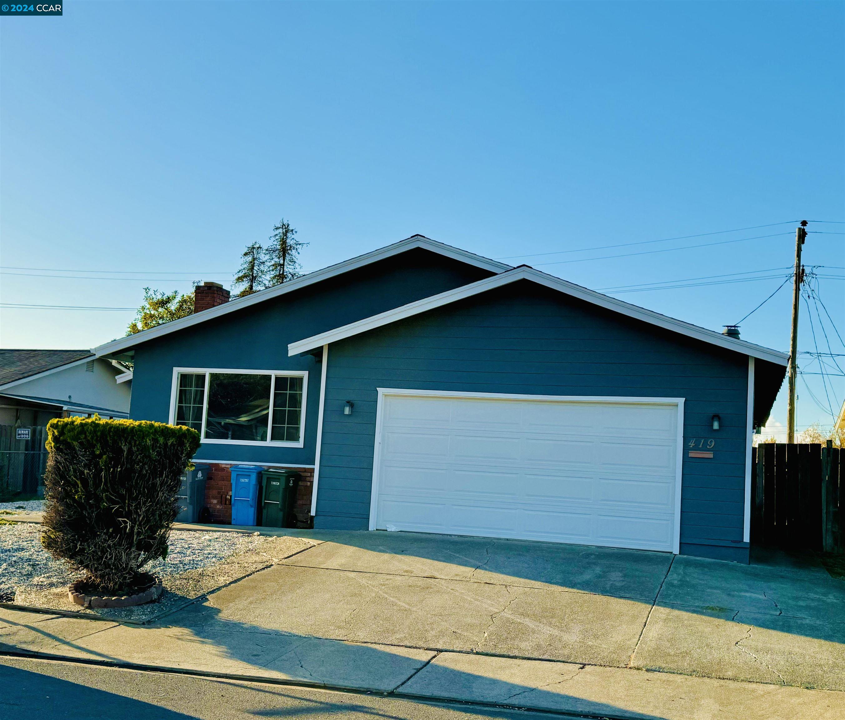 a view of a house with a garage