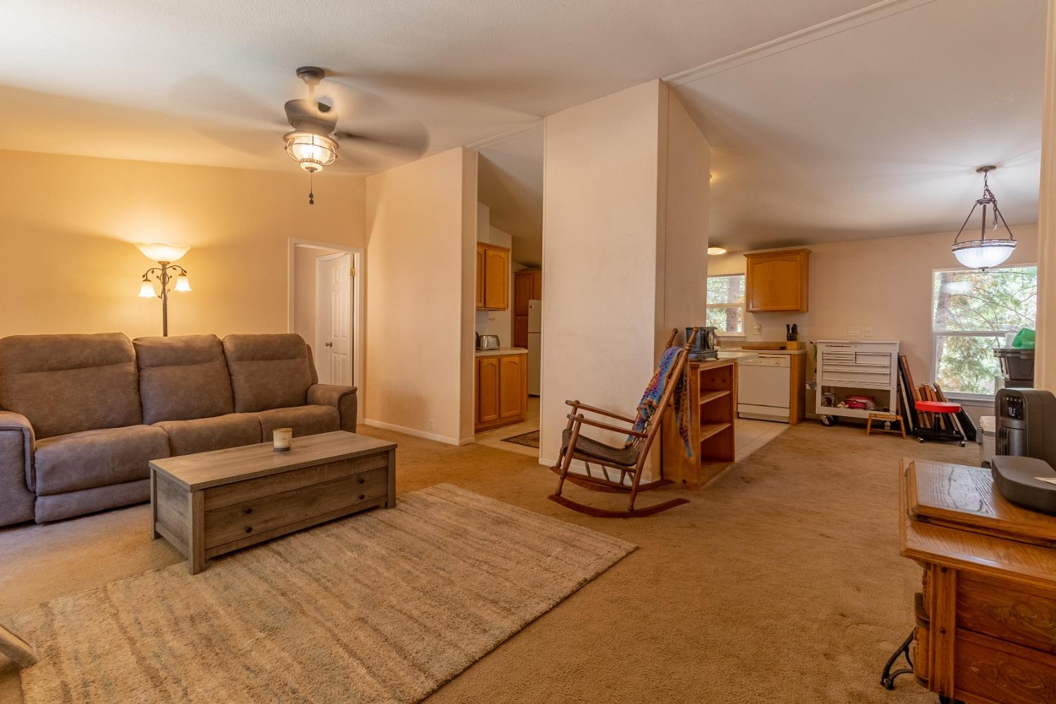 a living room with furniture a dining table and chairs