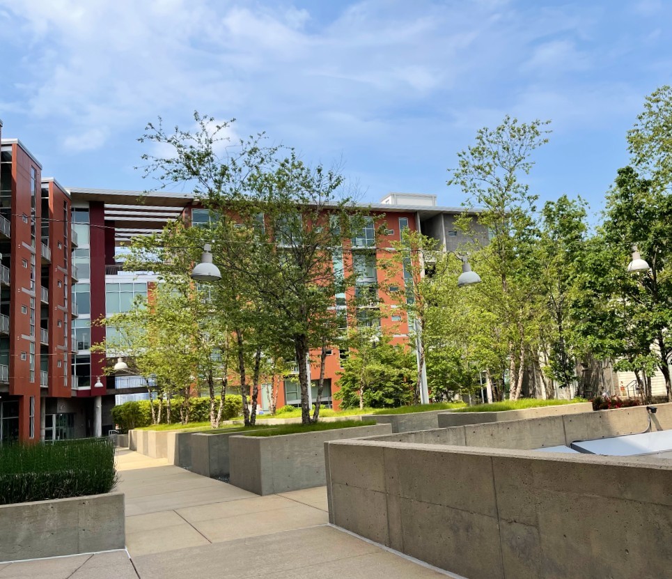 a view of a fountain in front of a brick building