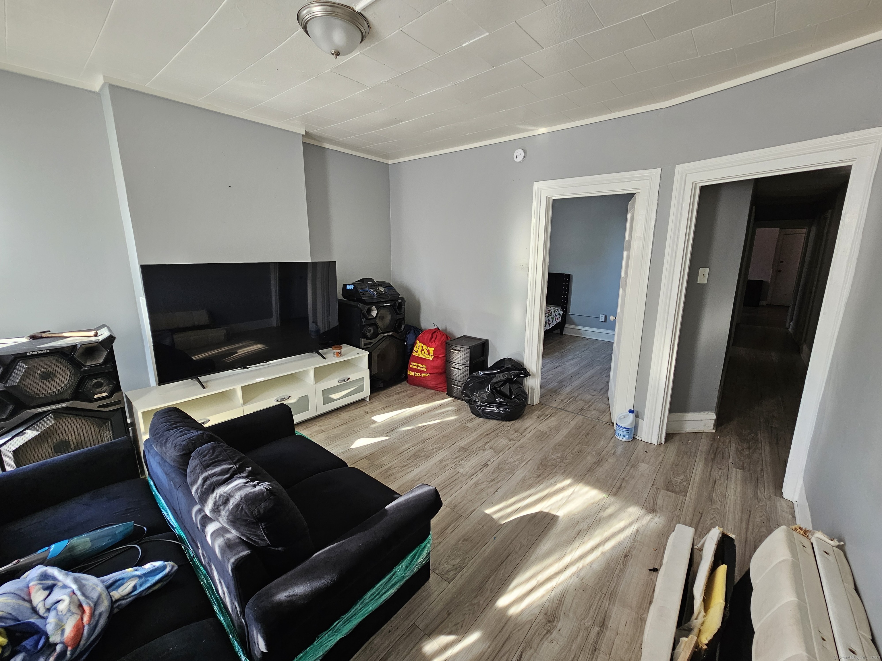 a view of livingroom with workspace and a couch