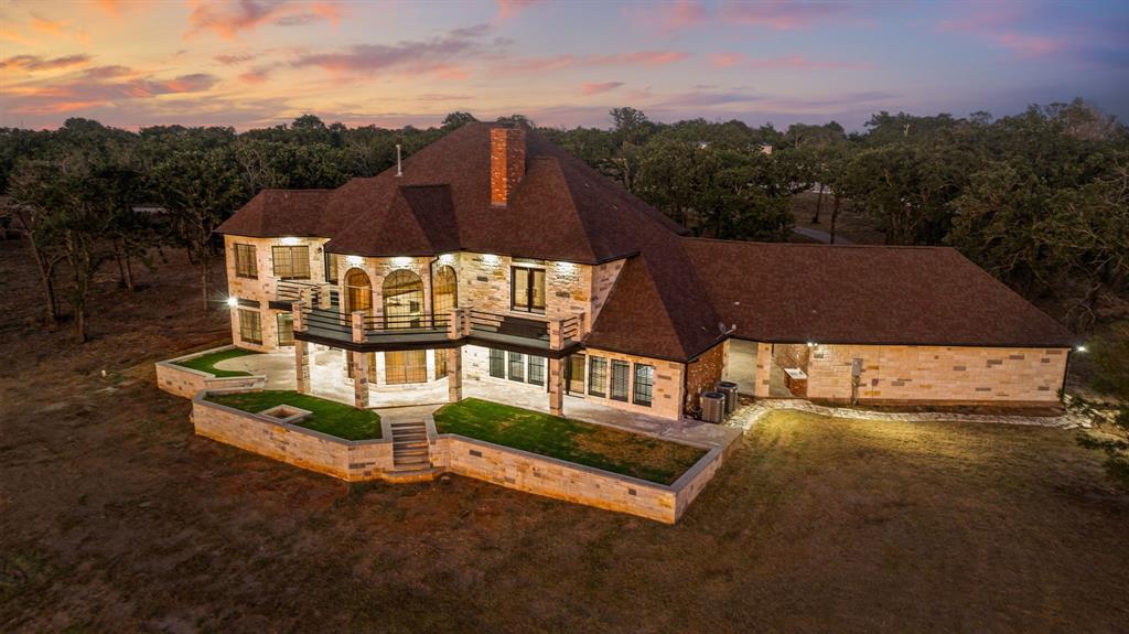 a view of a house with a big yard