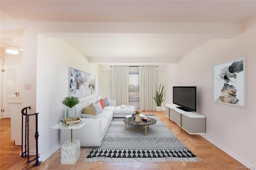 Virtually Staged. Living room featuring beam ceiling and light parquet flooring