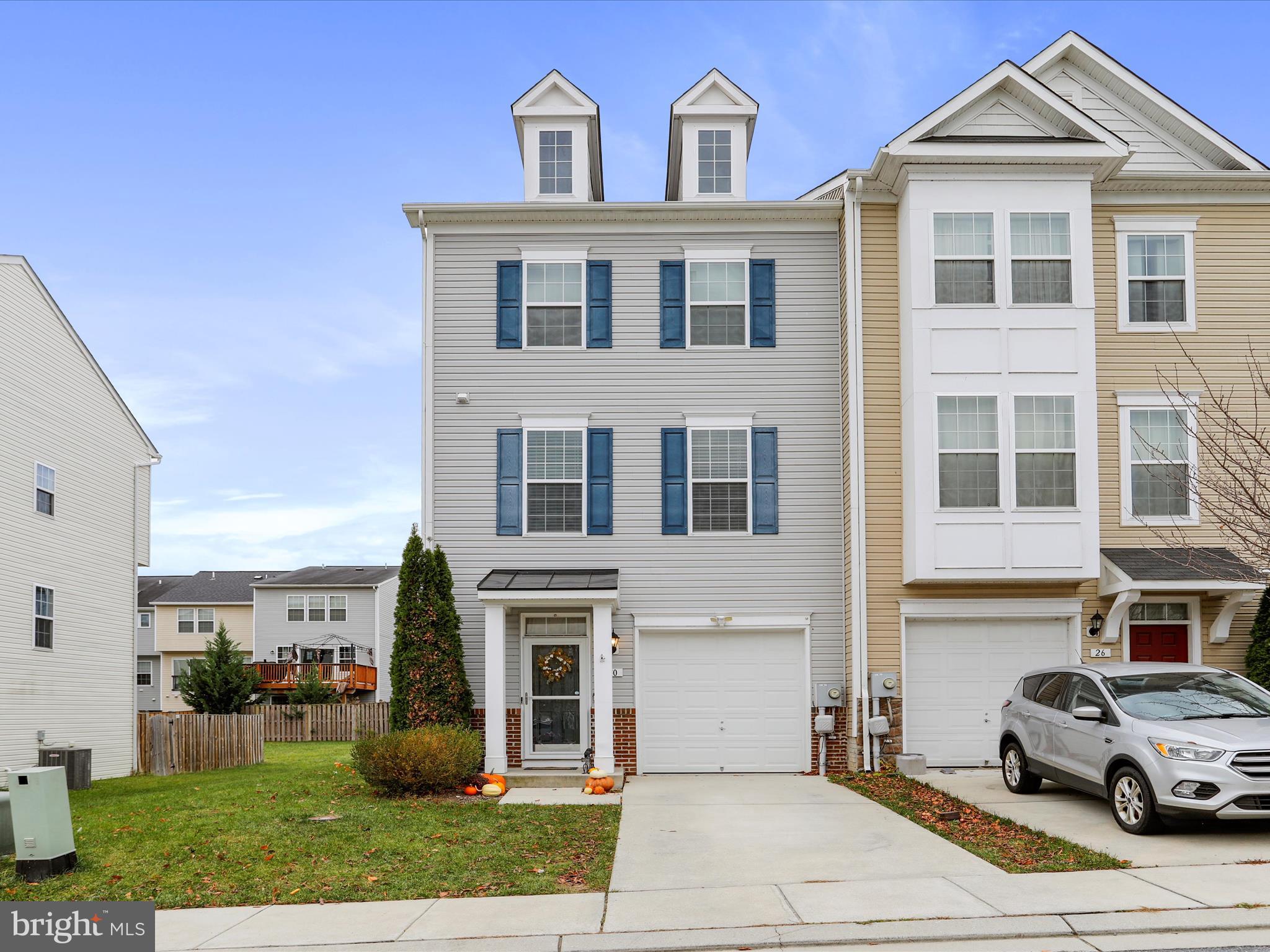 a view of multiple houses with a yard