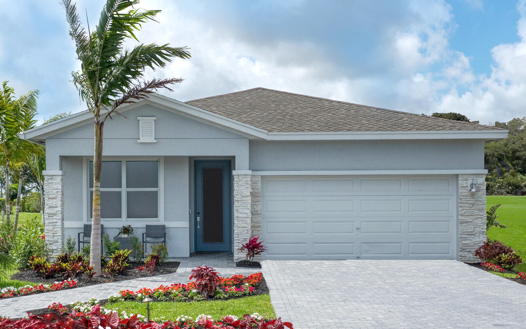 a front view of a house with a garden