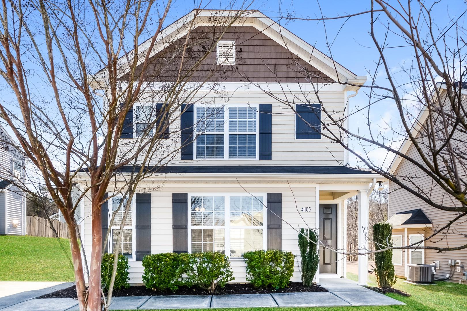 front view of a house with a tree