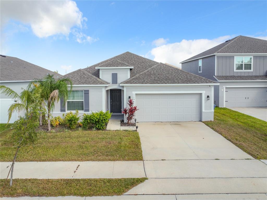 a front view of a house with a yard