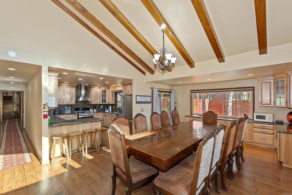 a view of a dining area with furniture window and wooden floor