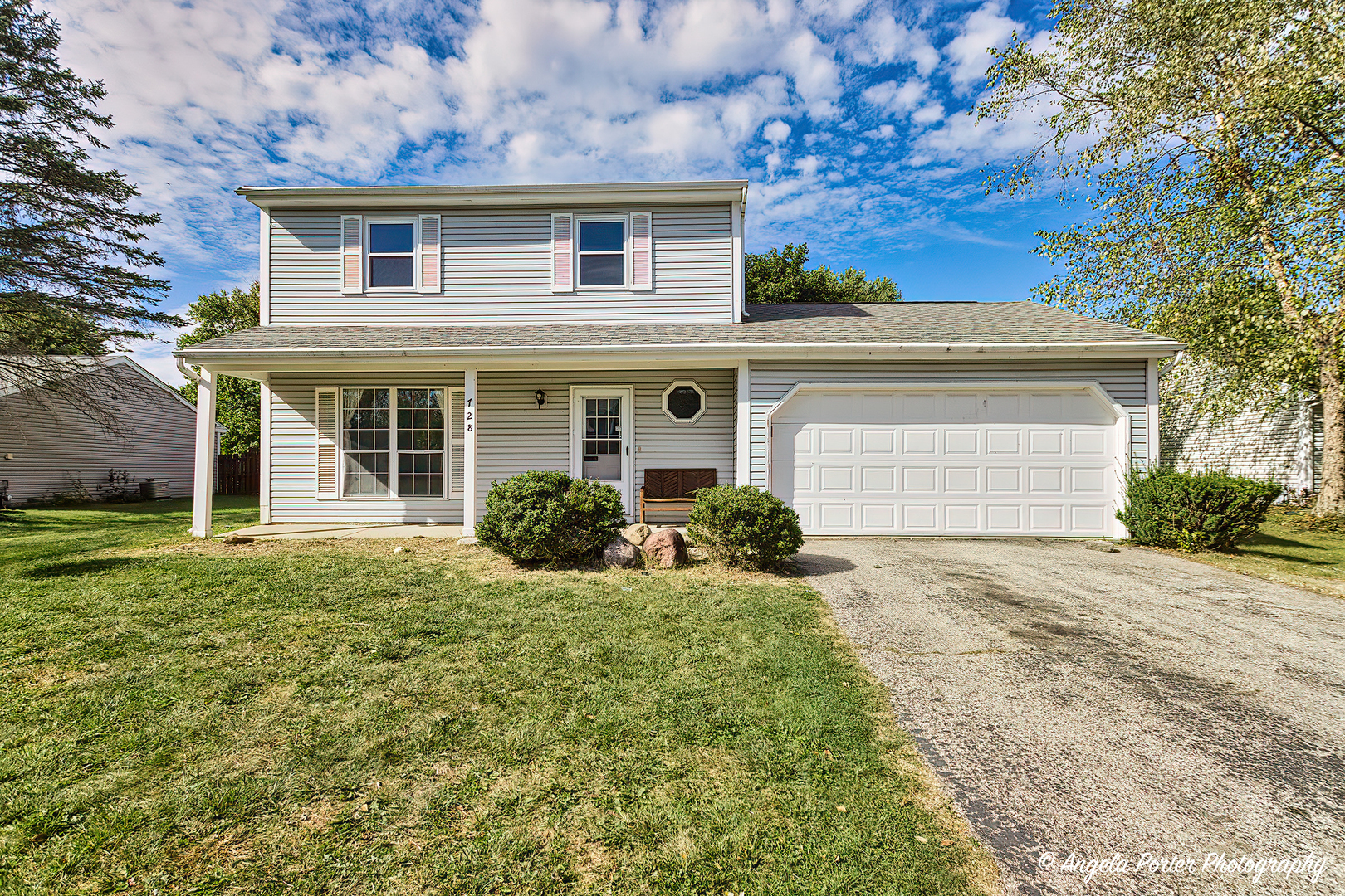 front view of a house with a yard