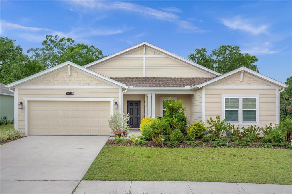 a view of front a house with a yard