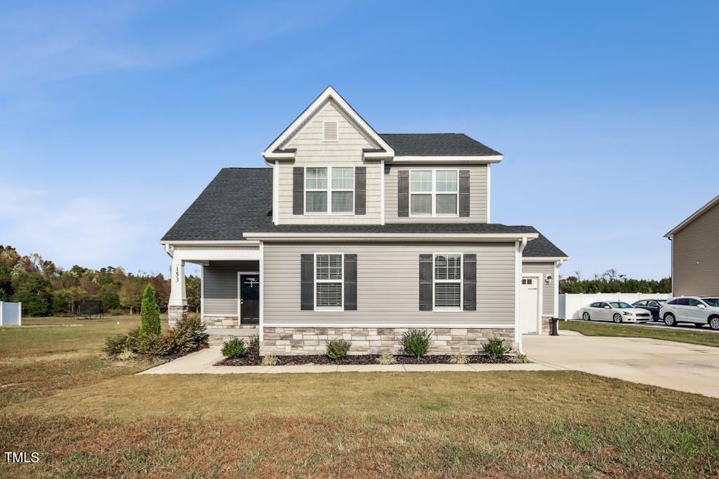 a front view of a house with a yard