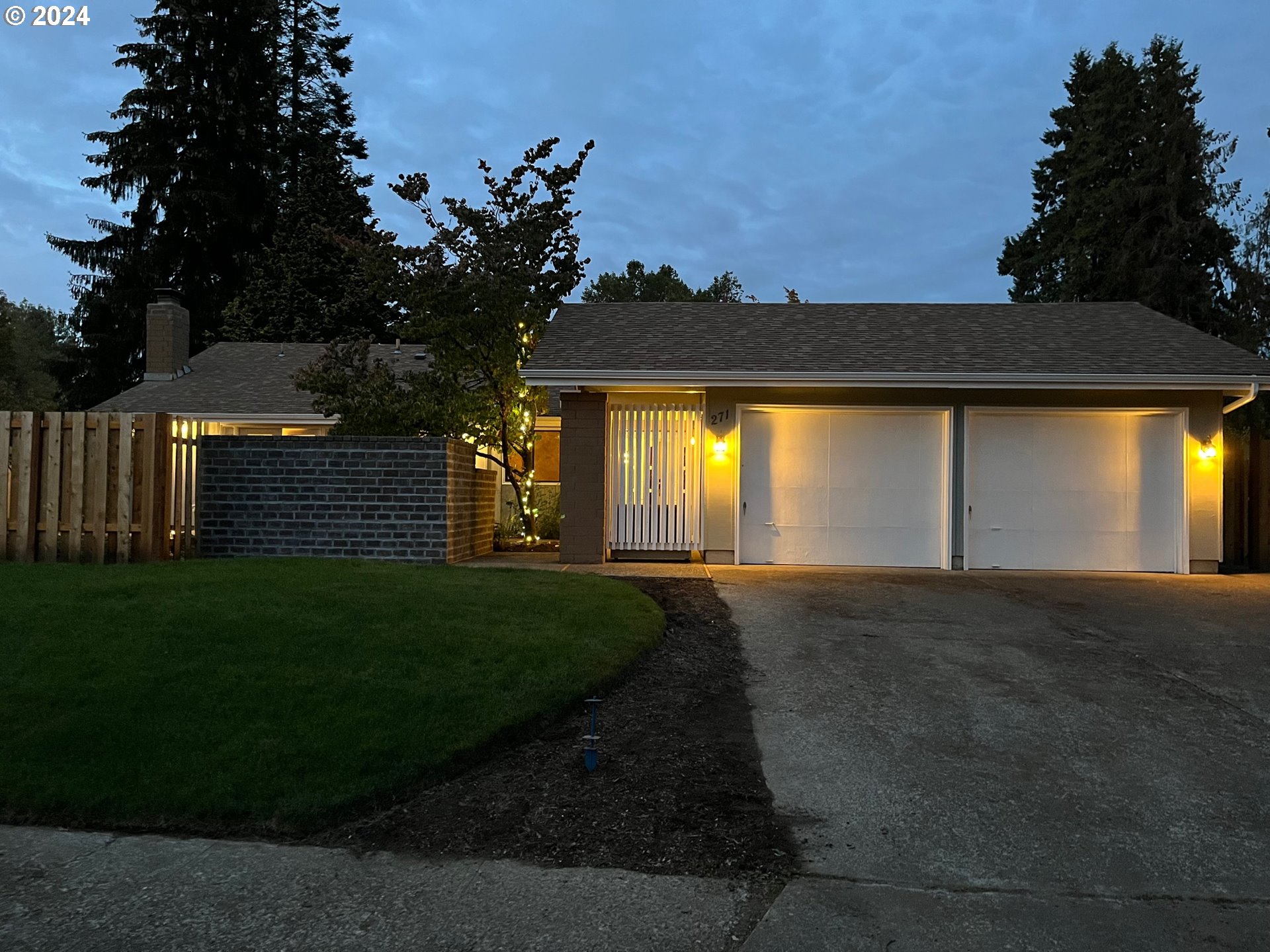 a house view with a garden space