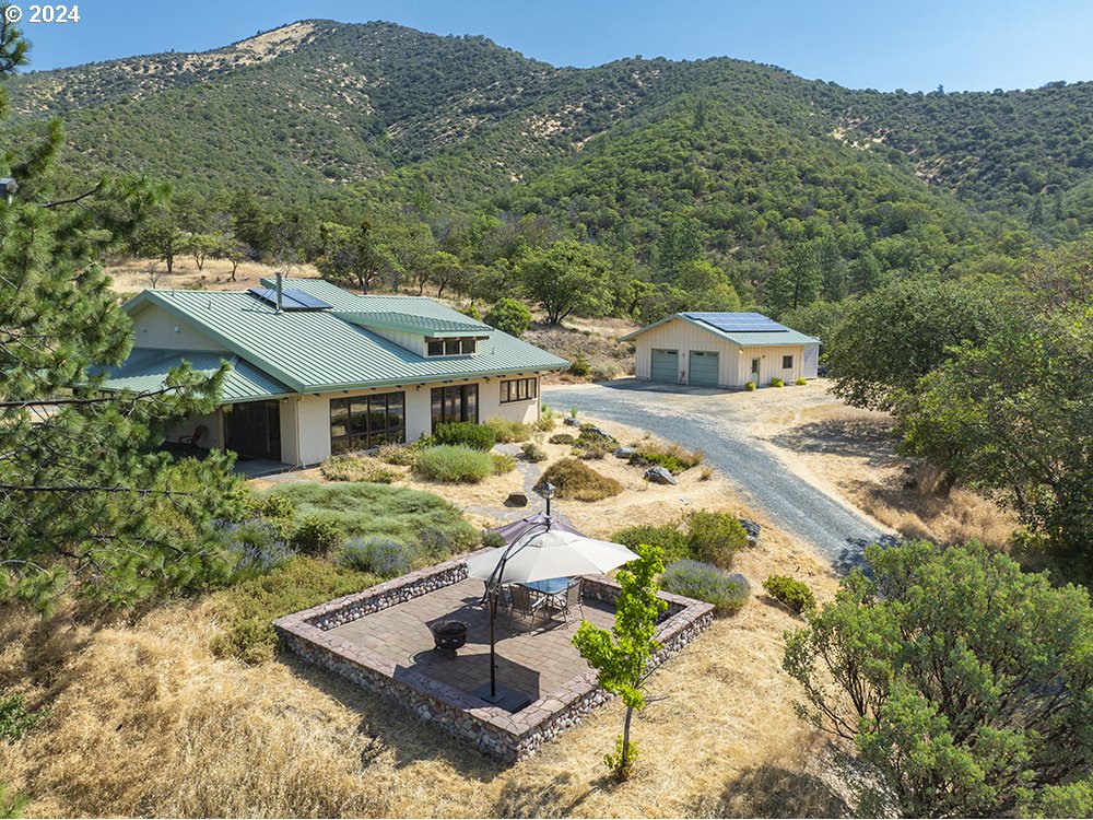 a aerial view of a house with a yard