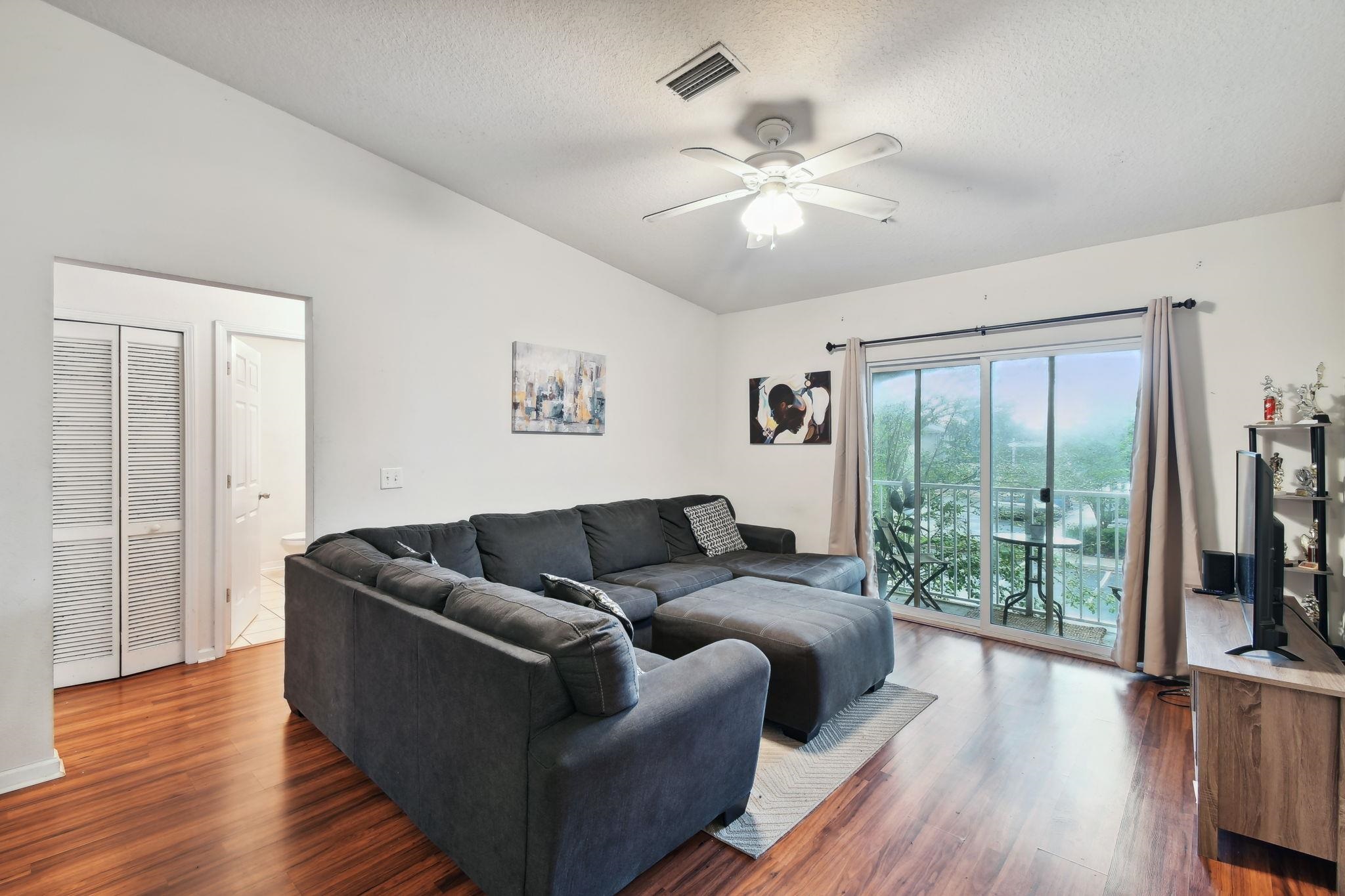 a living room with furniture and a large window