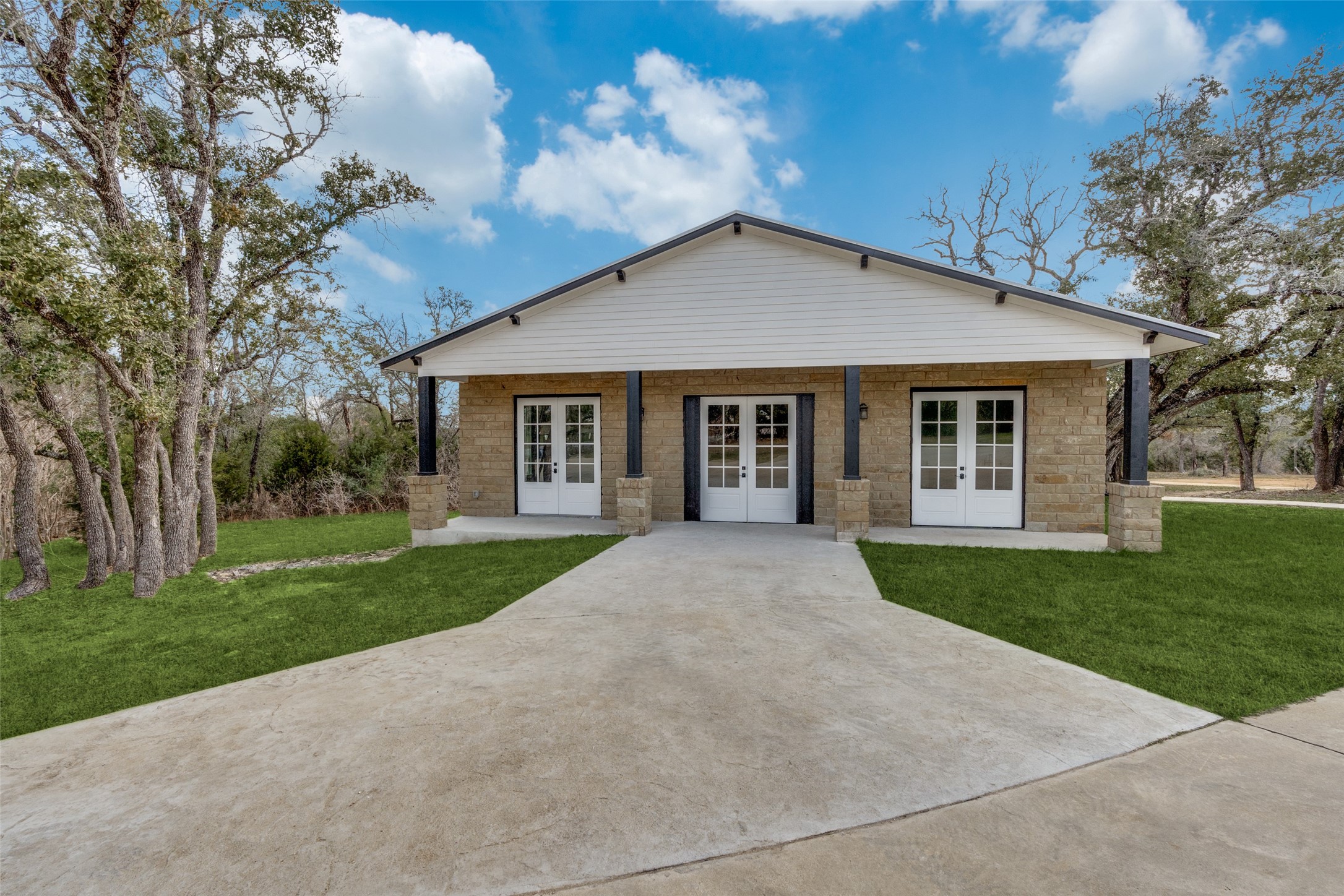 a front view of house with yard and green space