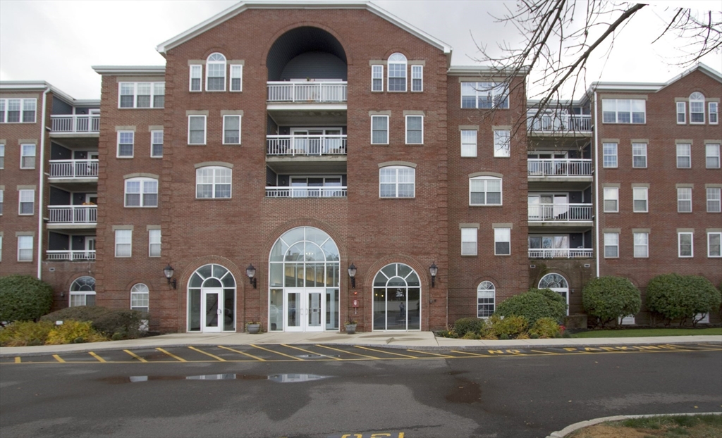 a front view of a building with street view