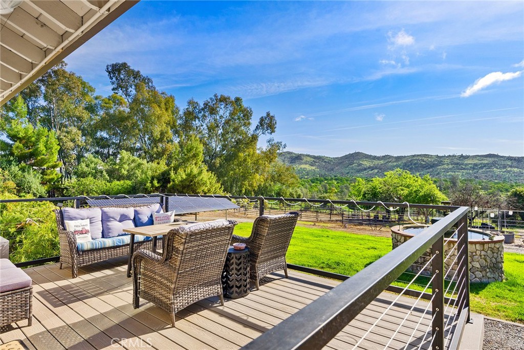 a view of a chairs on the roof deck