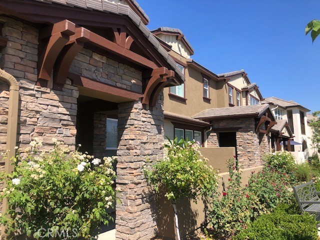 a front view of a house with a small garden