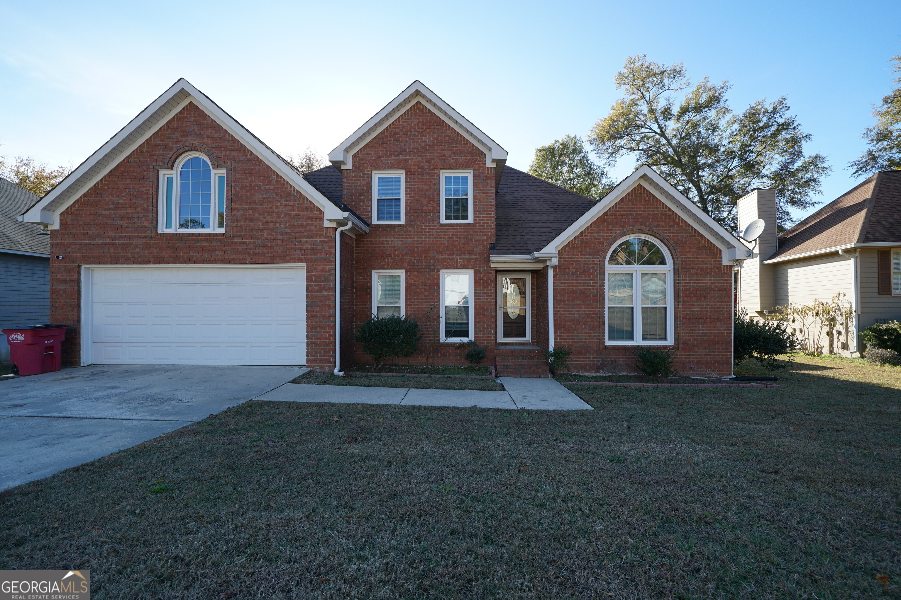 a front view of a house with a yard