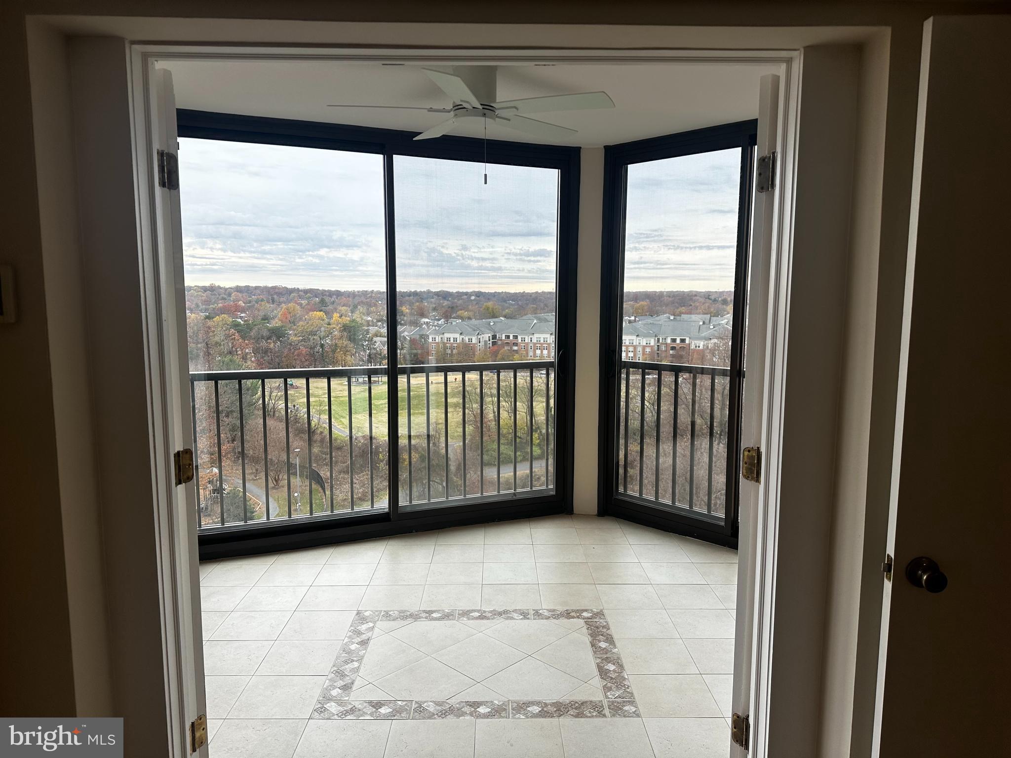 a view of a room that has a bed in it