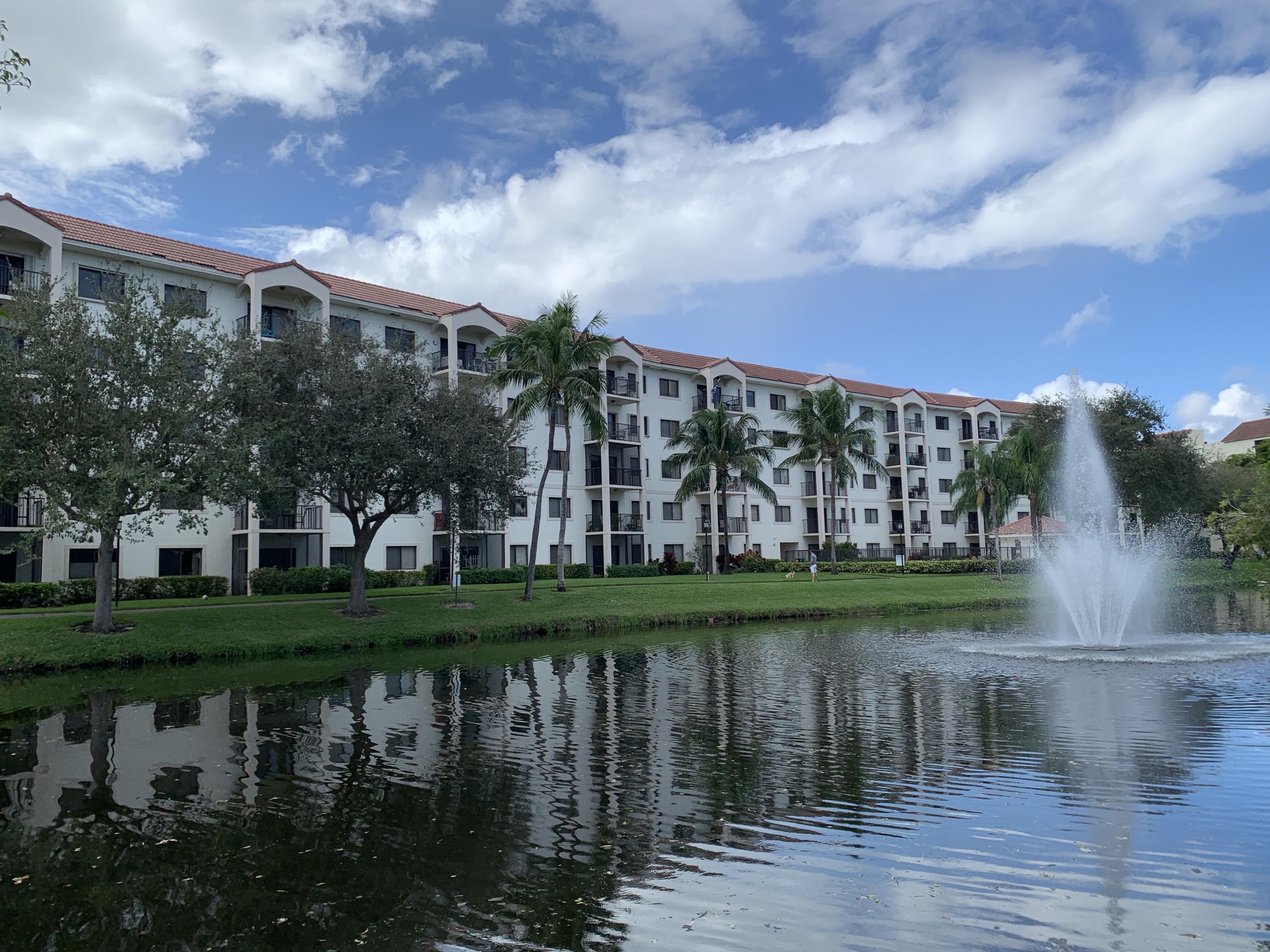 a view of residential house with outdoor space and lake