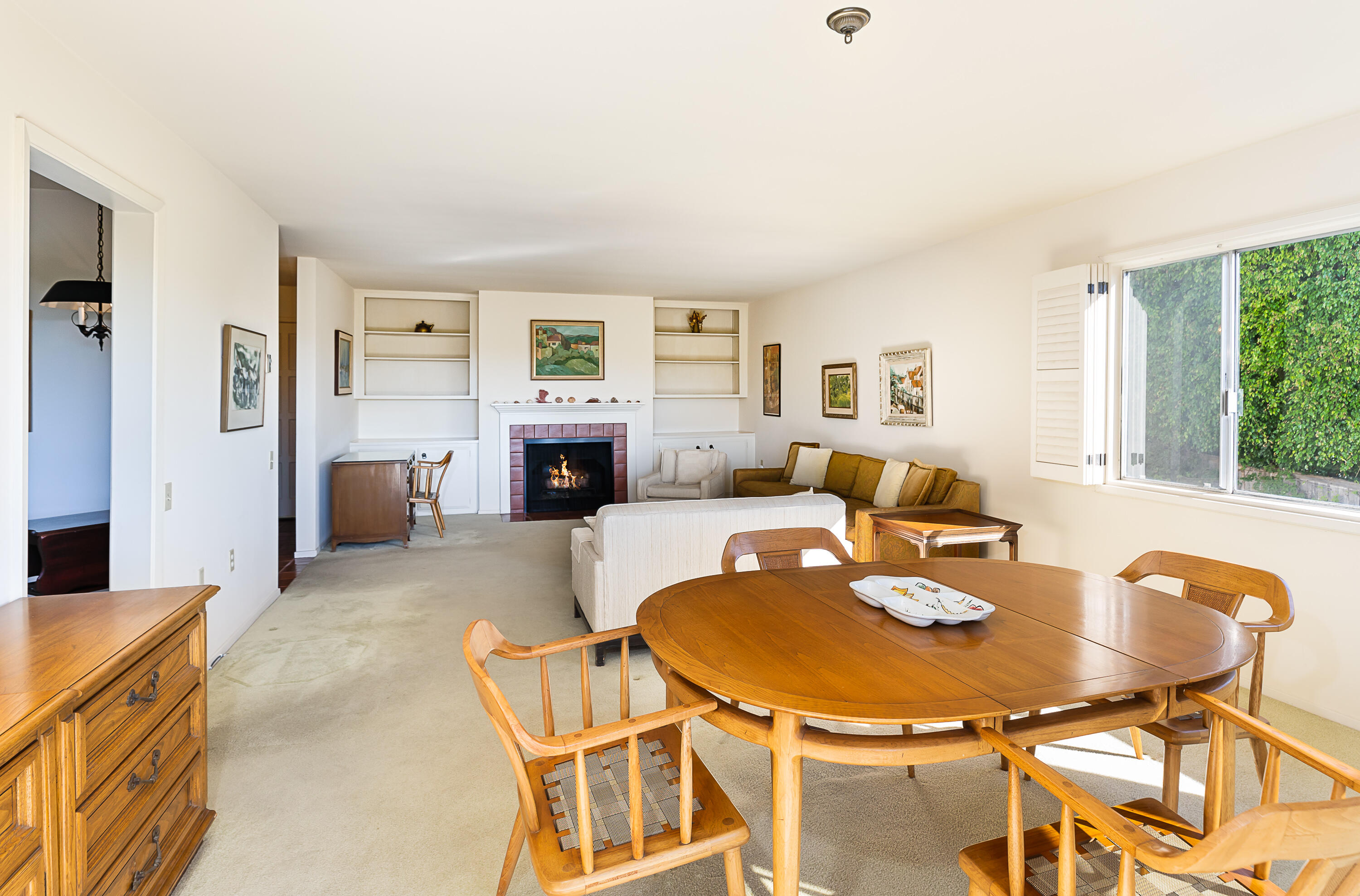 a living room with furniture and a table