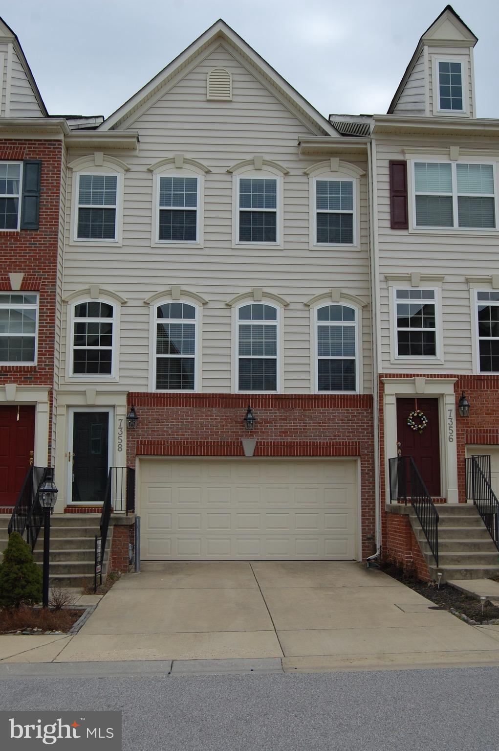 a front view of a house with a garage