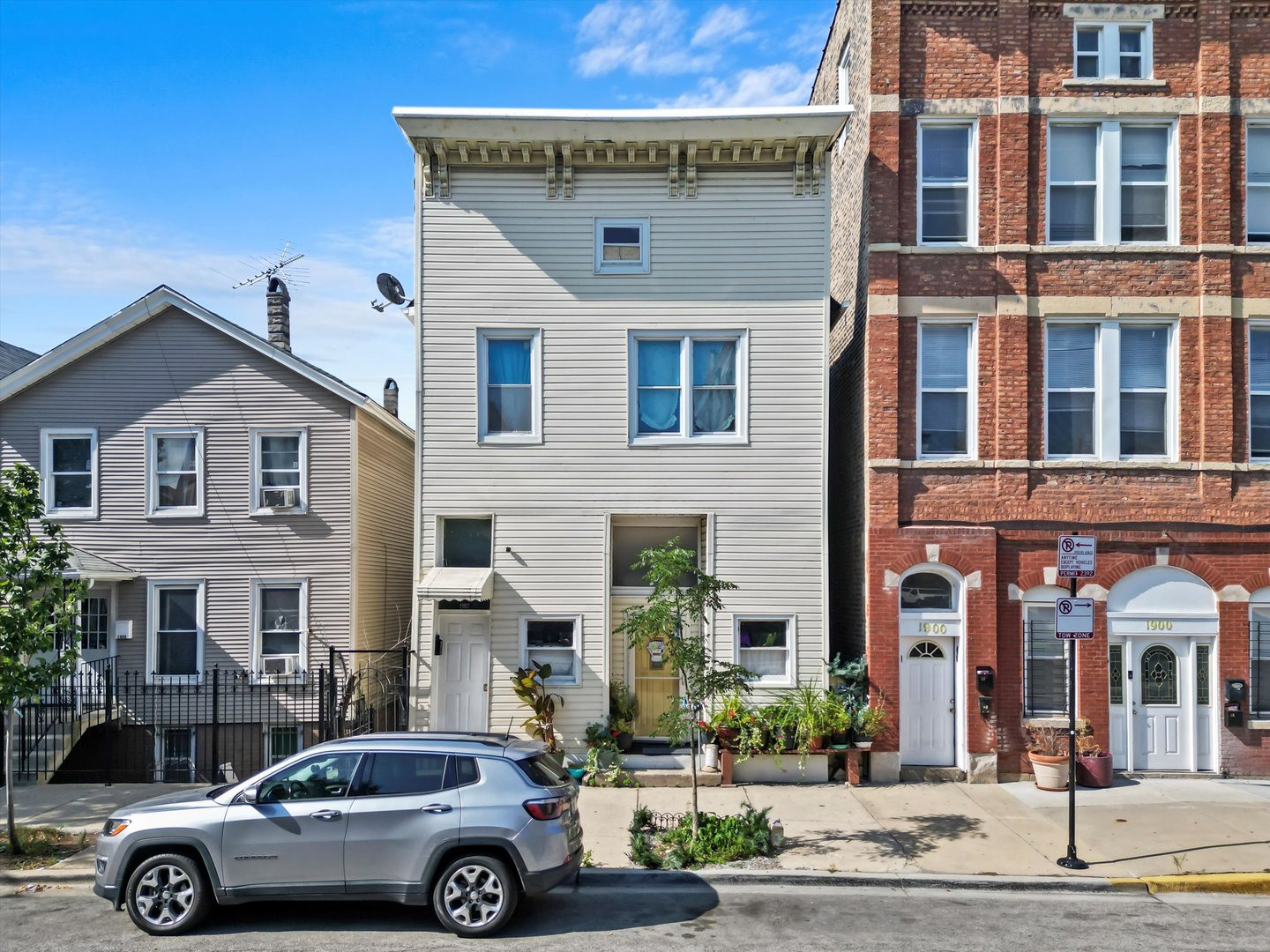 a front view of a house with parking space