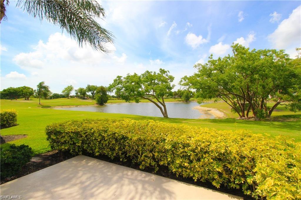 View of community featuring a lawn and a water view