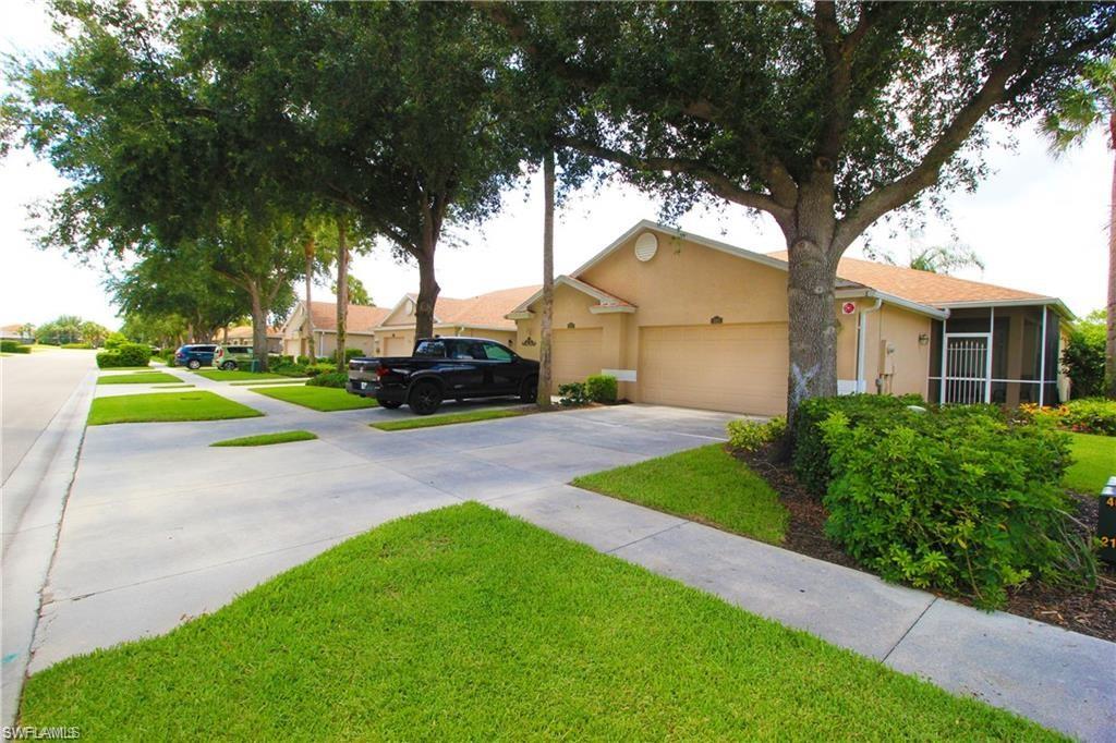 View of front of house featuring a garage and a front yard