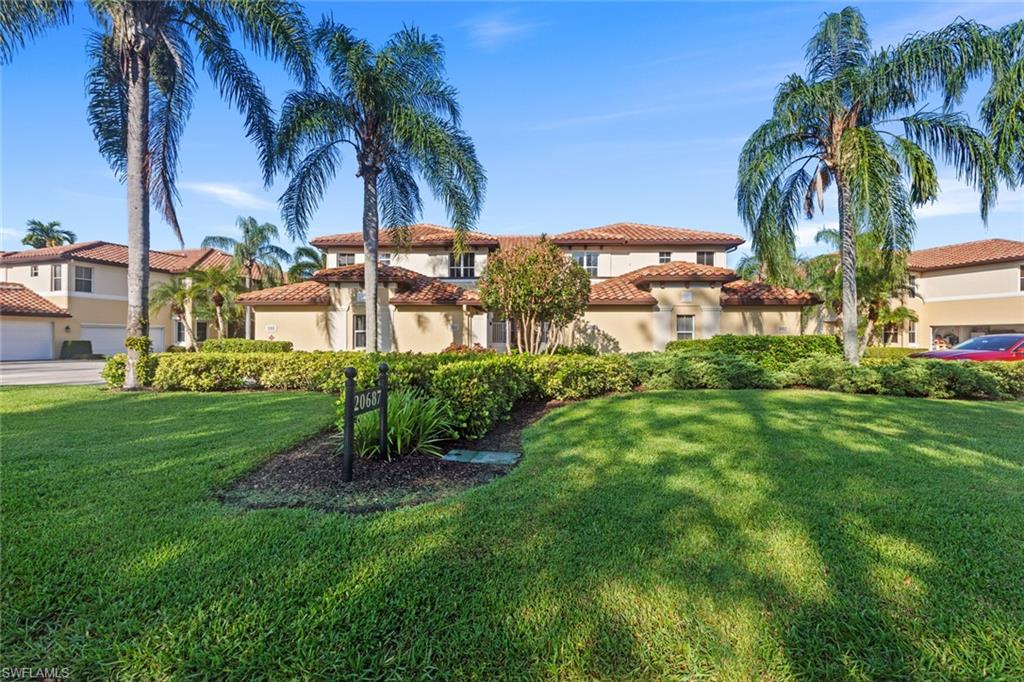 a view of a palm trees in front of a house