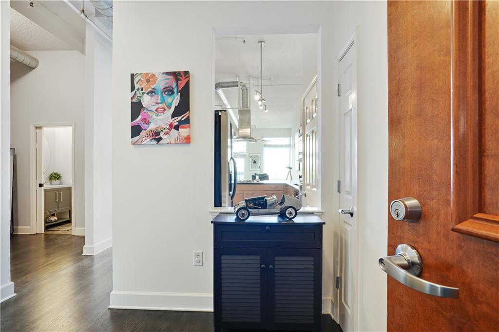 a bathroom with a painting on the wall and a shower