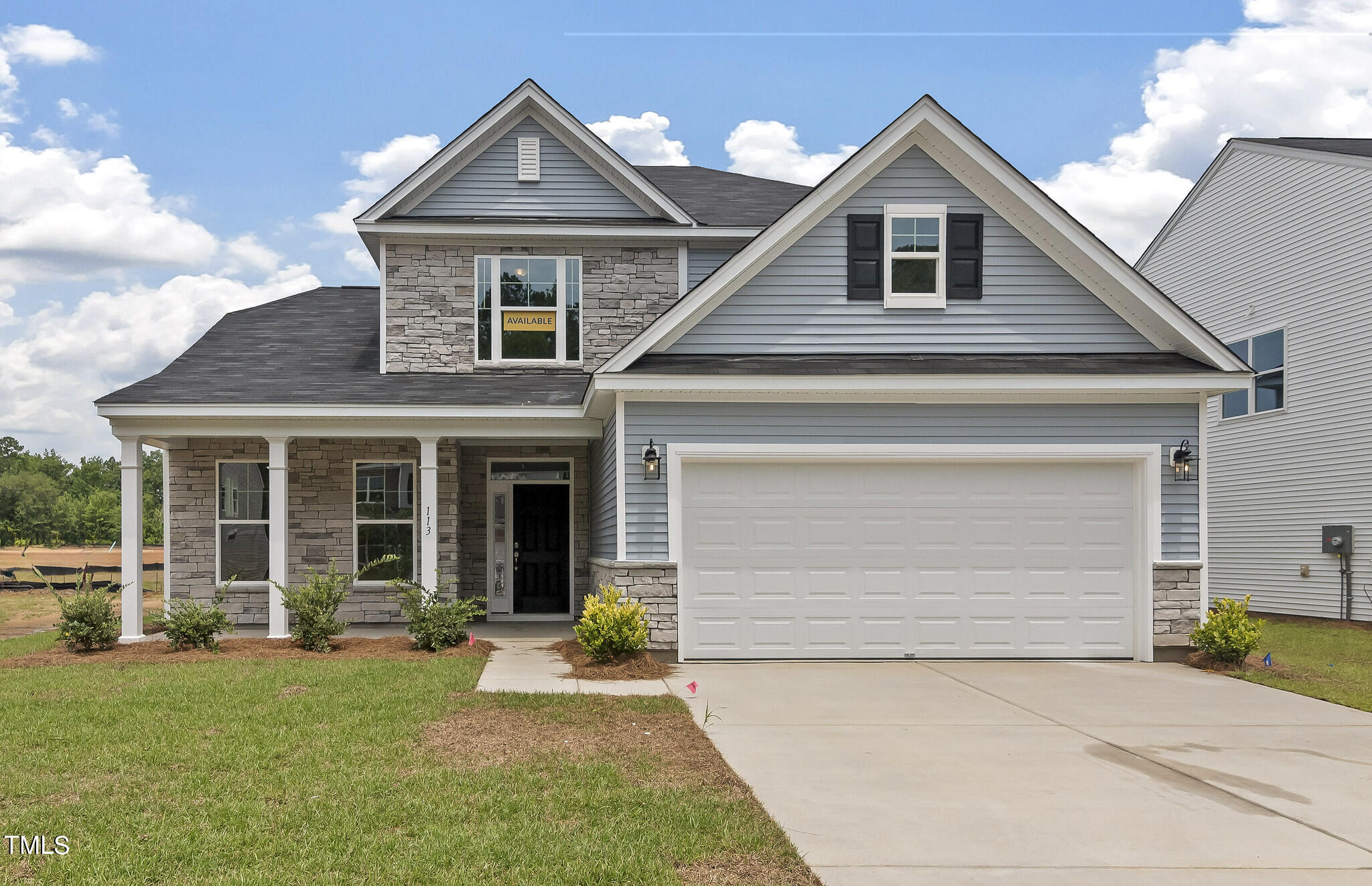 a front view of a house with yard