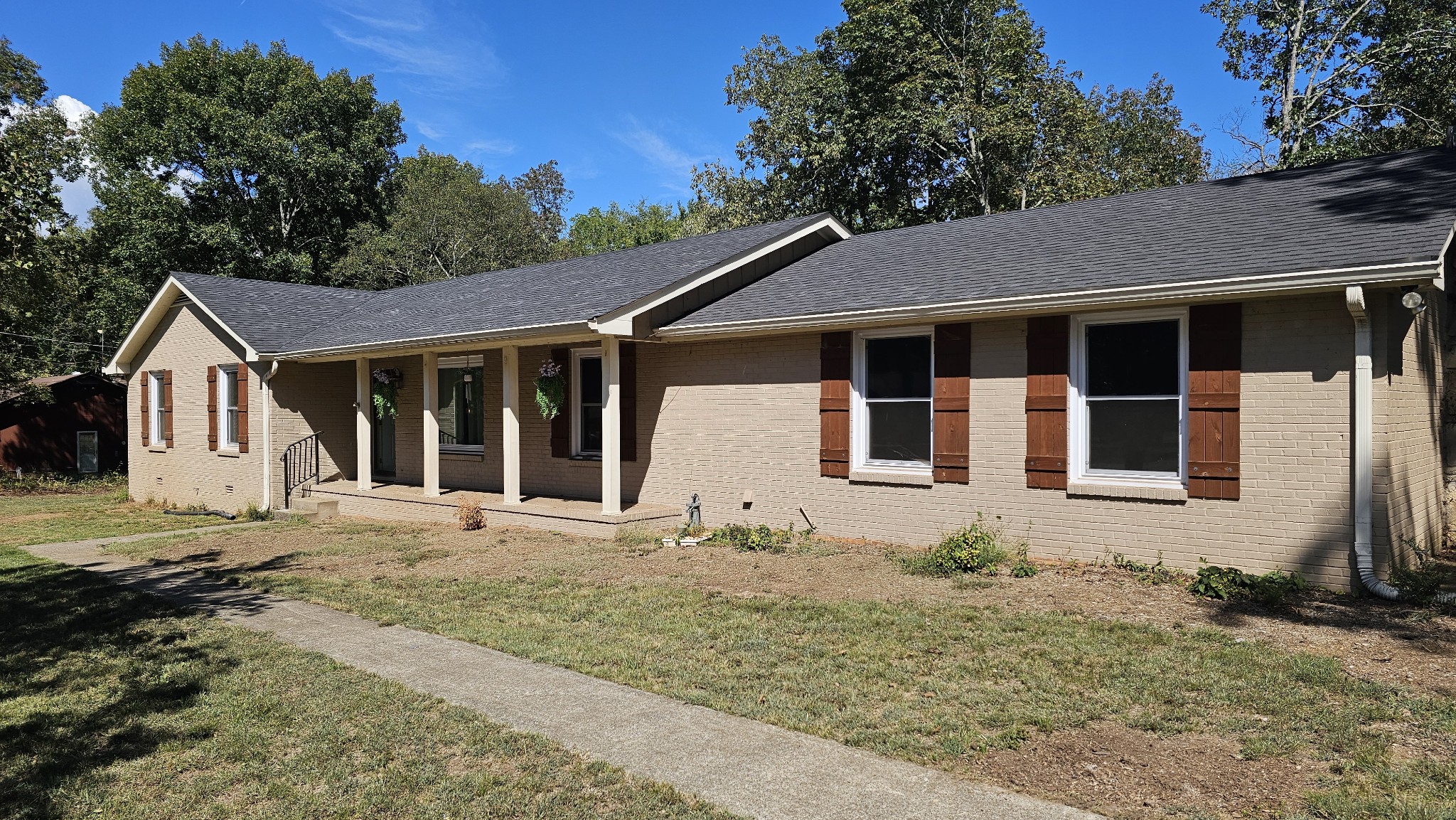 a front view of a house with a yard