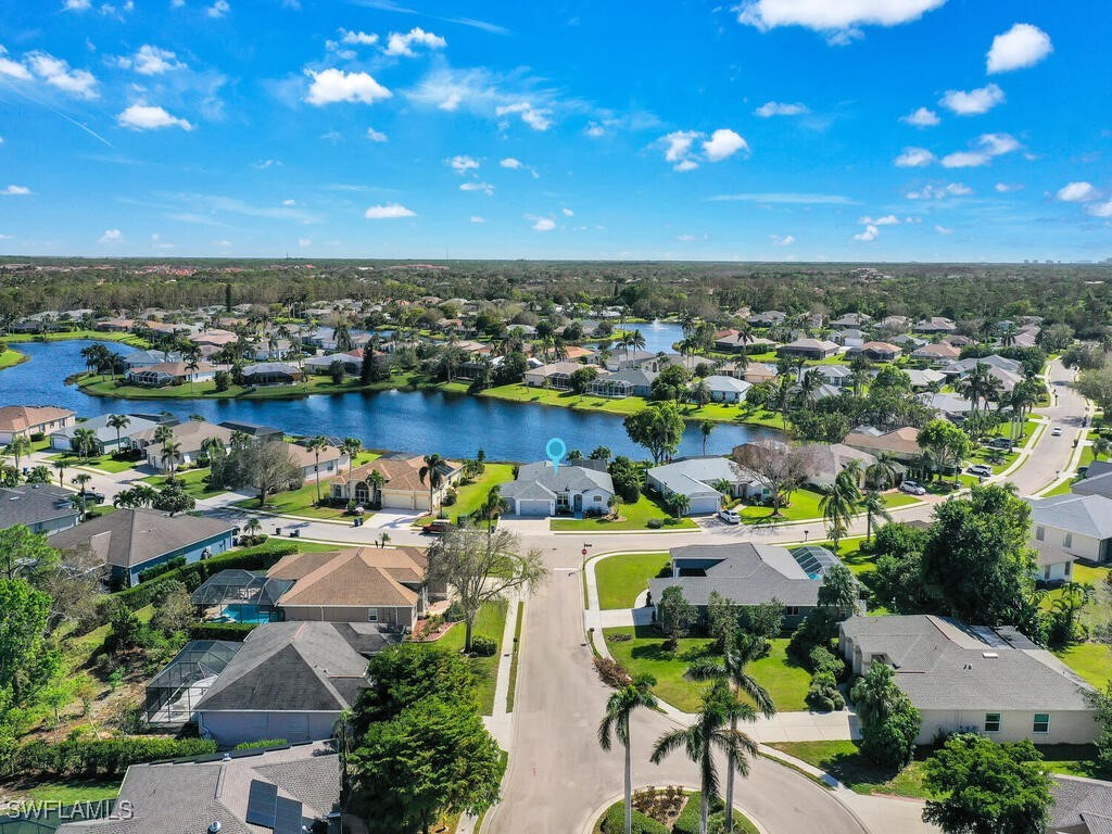 an aerial view of a house with outdoor space