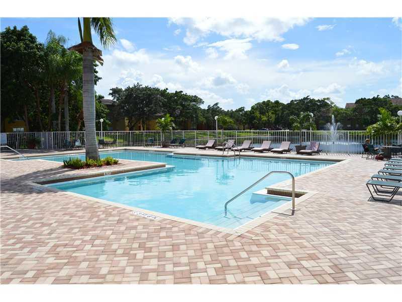 a view of a swimming pool with lounge chair