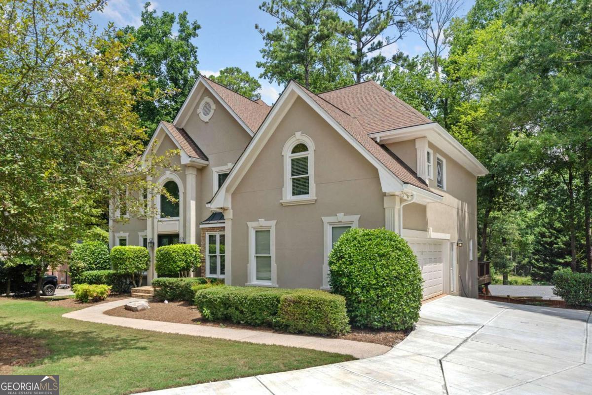 a front view of a house with garden