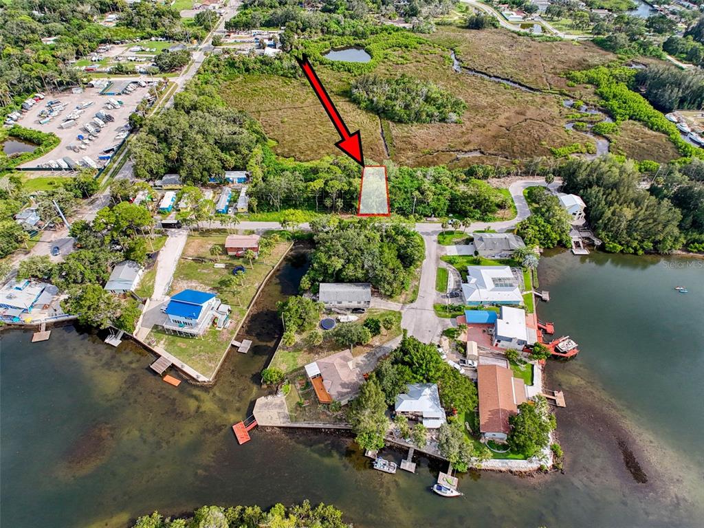 an aerial view of a house with a yard and garden