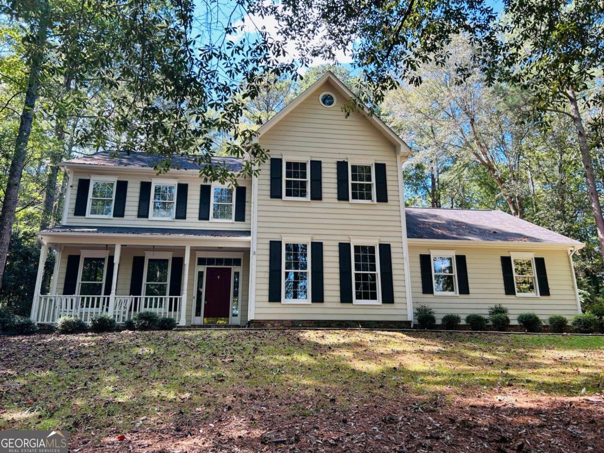 front view of a house with a yard